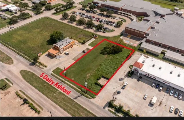an aerial view of a residential houses with outdoor space