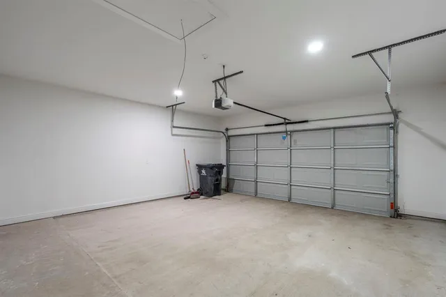 a view of a yard in front of a house with large tree