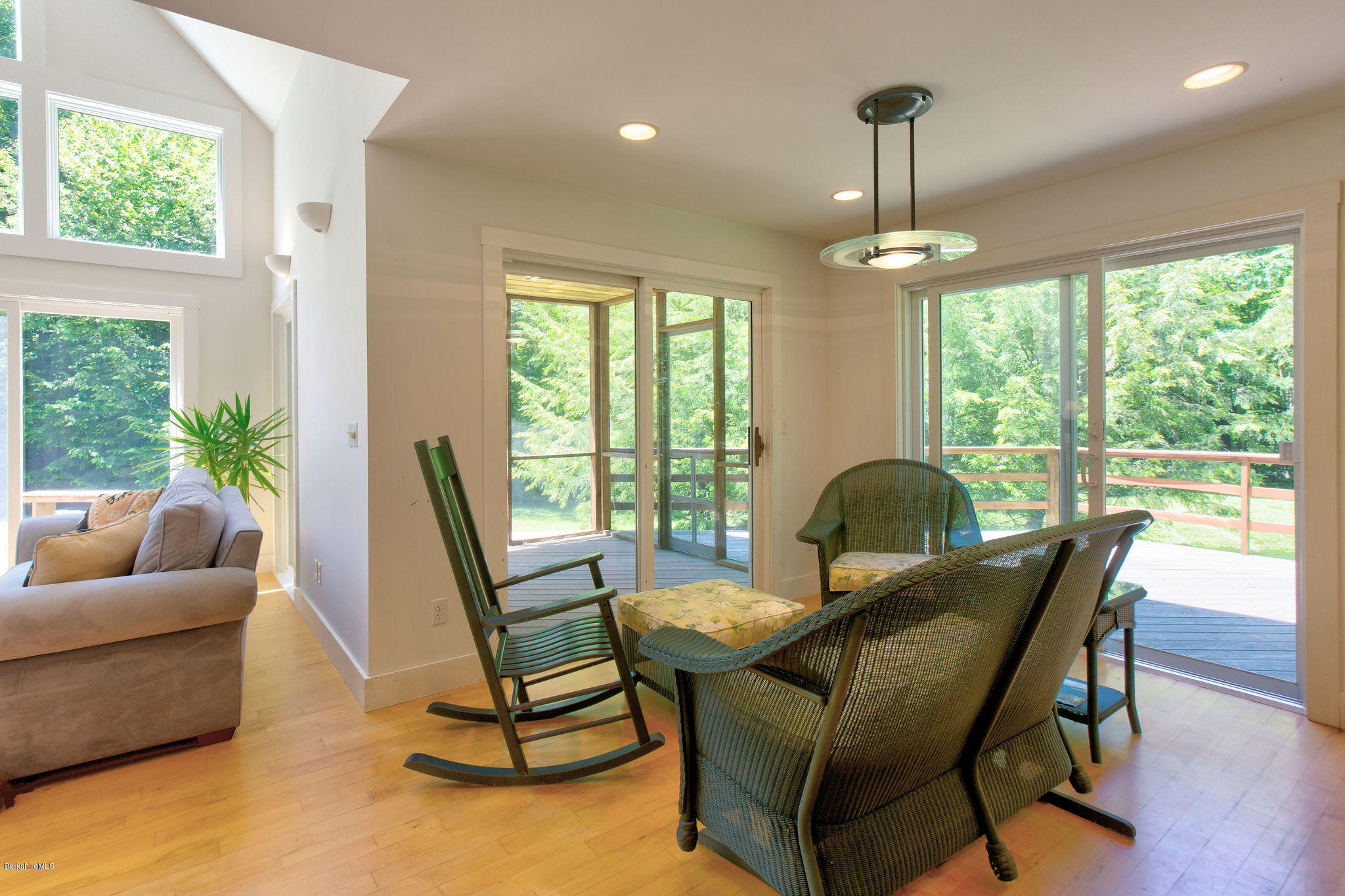 760 Dimmock Road Otis, MA 01253 - Photo 5 of 28 a living room with furniture and a floor to ceiling windows