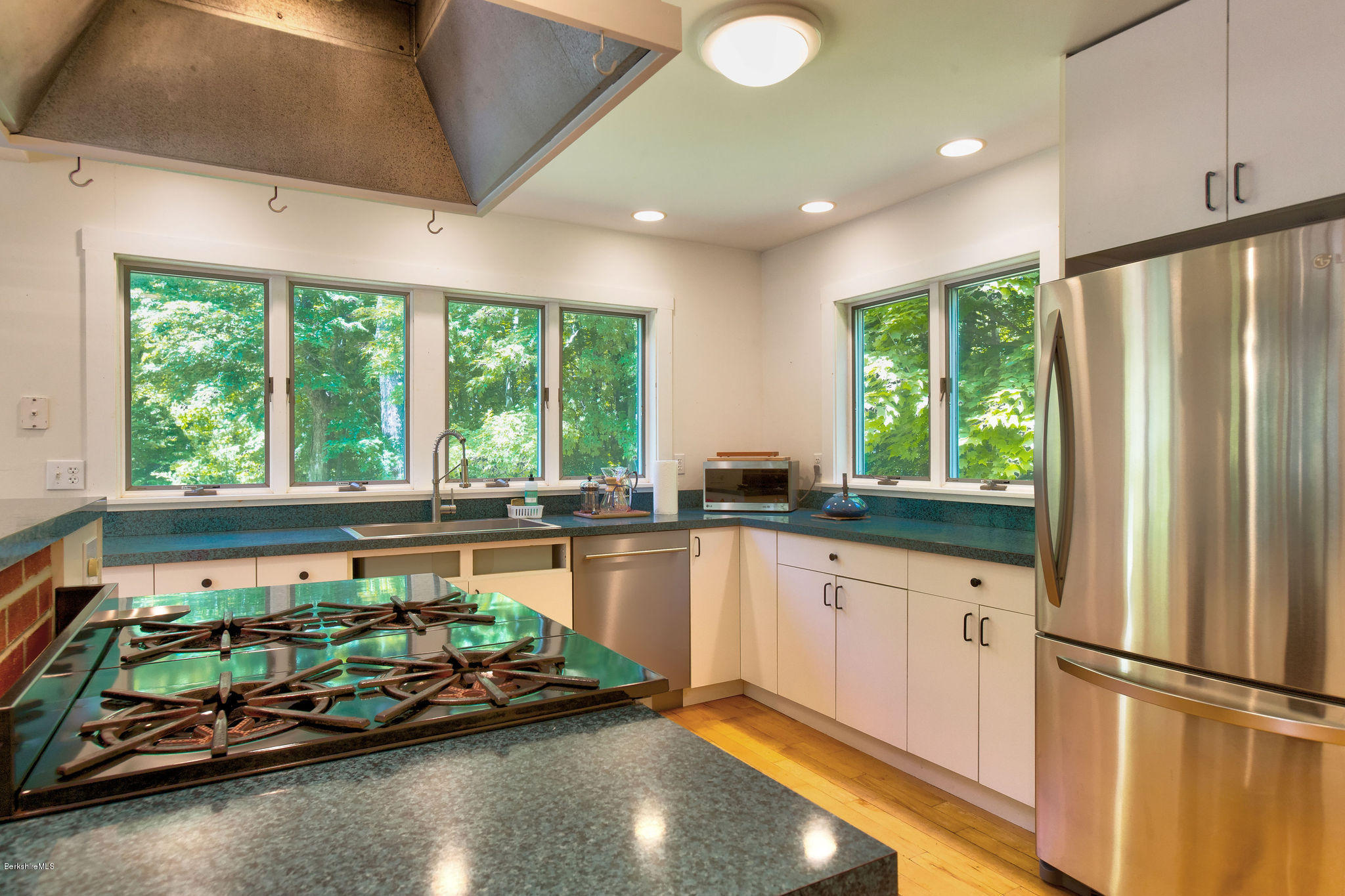 760 Dimmock Road Otis, MA 01253 - Photo 7 of 28 a kitchen with a large window and refrigerator