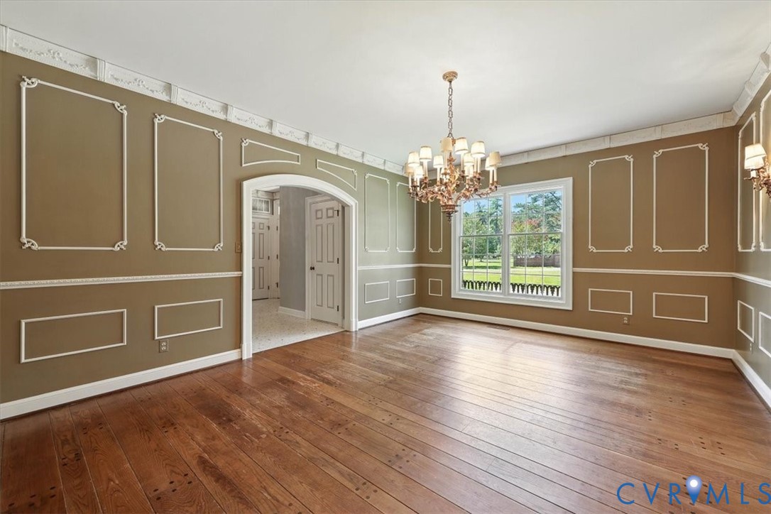 11701 Johnson Road Petersburg, VA 23805 - Photo 20 of 37 a view of an empty room with wooden floor and a window