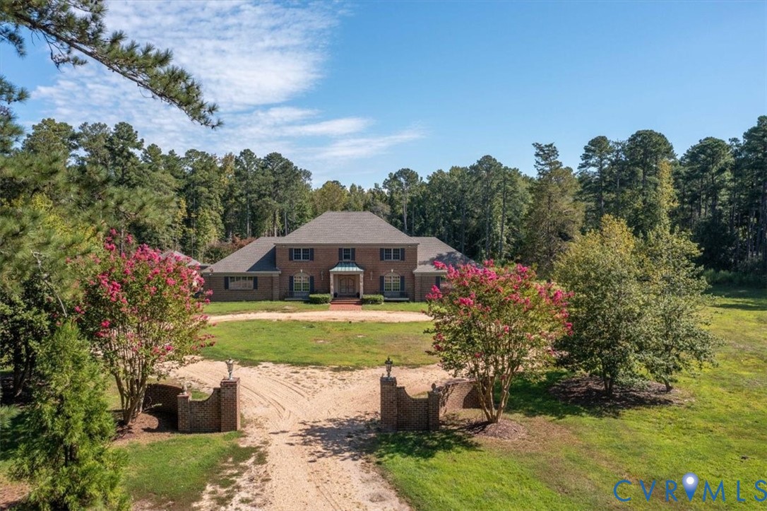 11701 Johnson Road Petersburg, VA 23805 - Photo 2 of 37 a front view of a house with garden