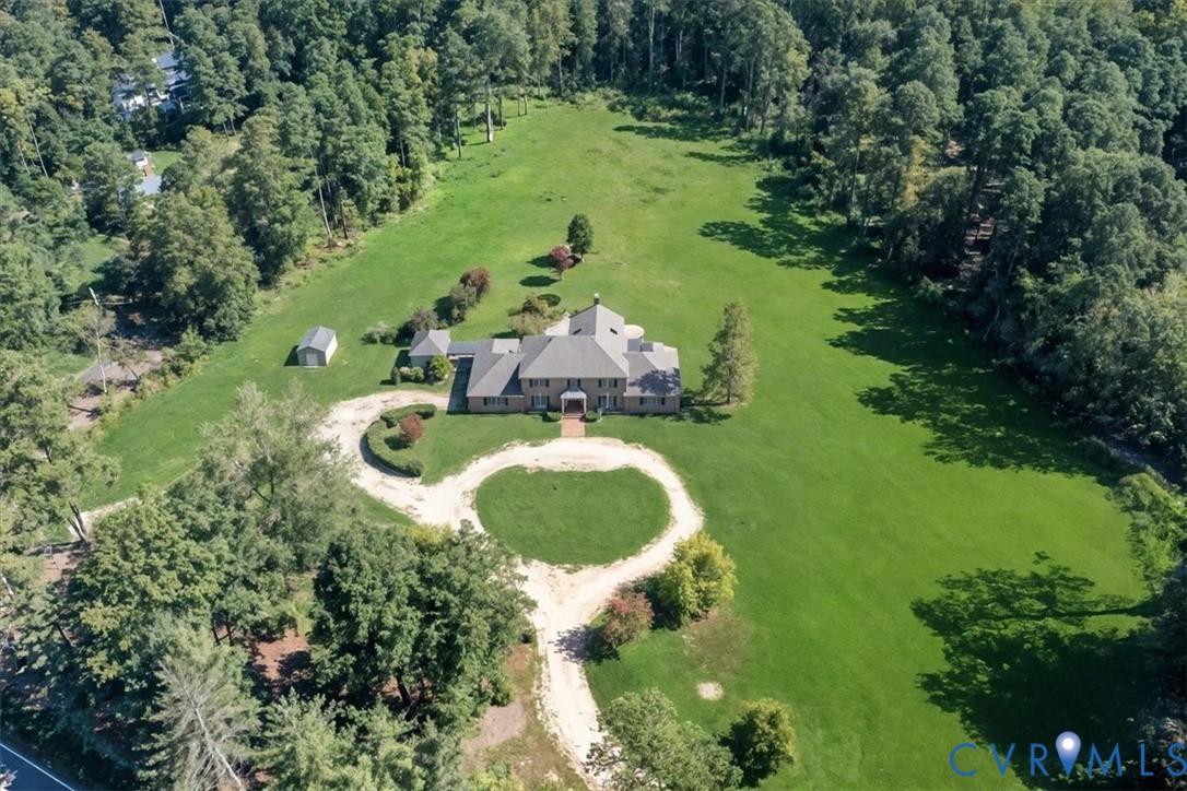 11701 Johnson Road Petersburg, VA 23805 - Photo 37 of 37 an aerial view of a house with swimming pool and garden