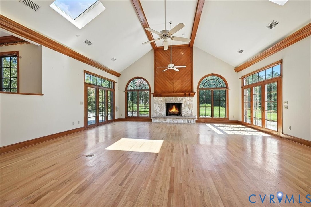 11701 Johnson Road Petersburg, VA 23805 - Photo 9 of 37 a view of empty room with fireplace and wooden floor