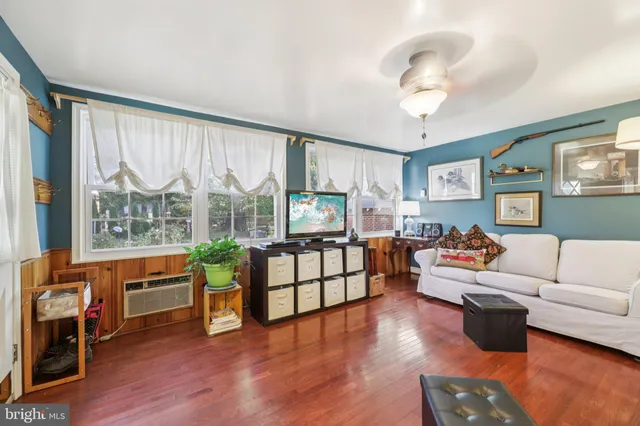 a view of a dining room with furniture and window