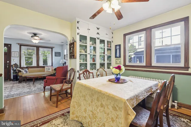 a kitchen with kitchen island granite countertop a sink cabinets appliances and a window
