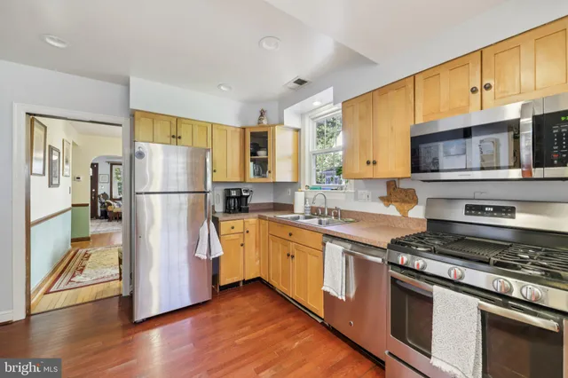 a bedroom with furniture and a dresser