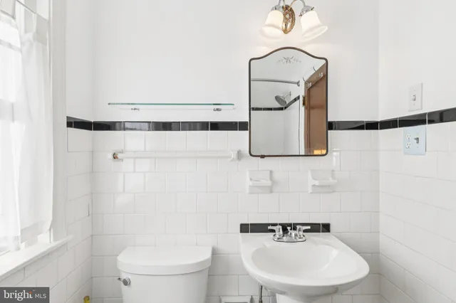 a view of a bedroom with furniture and wooden floor