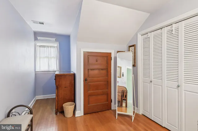 a bathroom with a toilet a sink and a mirror