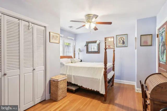 a bathroom with a sink mirror and a toilet