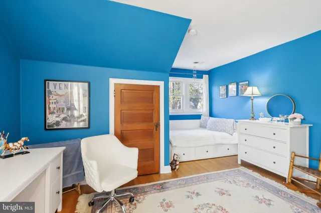 a bathroom with a sink vanity mirror and toilet