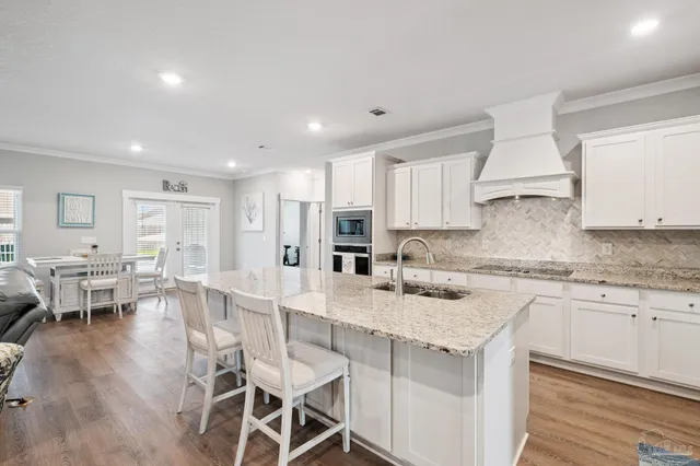 a bedroom with a large bed and a flat screen tv