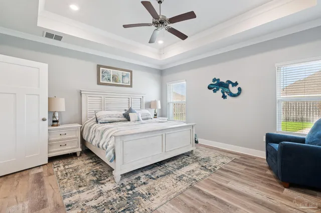 a spacious bathroom with a granite countertop sink and a mirror