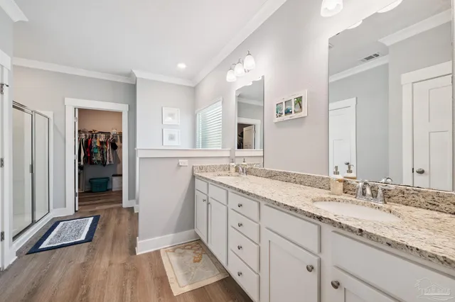 a view of walk in closet with clothes