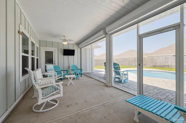 a view of a house with swimming pool and a yard