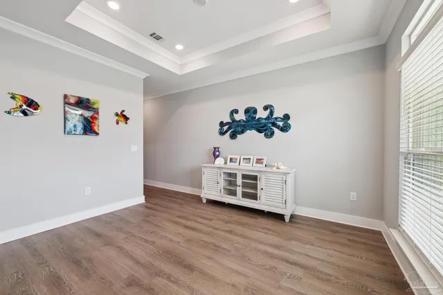 a room with a bed and a chandelier