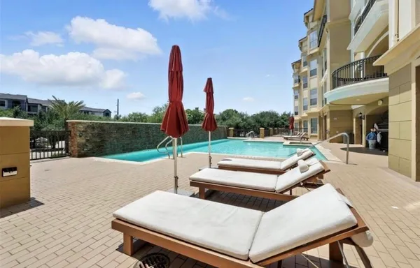 a view of a patio with a table and chairs