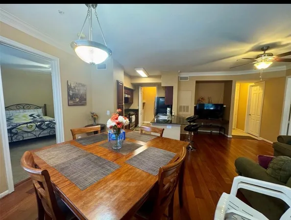 a view of a dining room with furniture and wooden floor