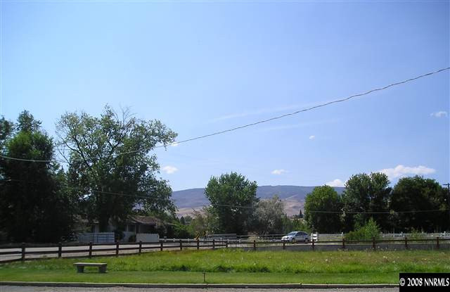 1175 Del Monte Lane Reno, NV 89511 - Photo 4 of 6 a view of a golf course with a lake