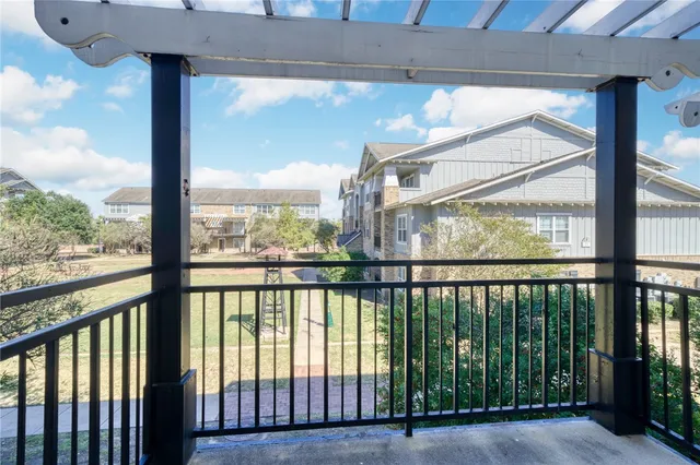 a view of swimming pool from a balcony
