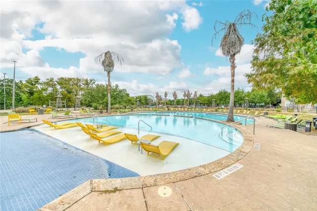a view of a patio with a table and chairs