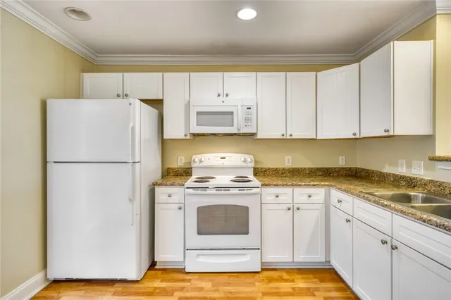 a kitchen with a sink and cabinets