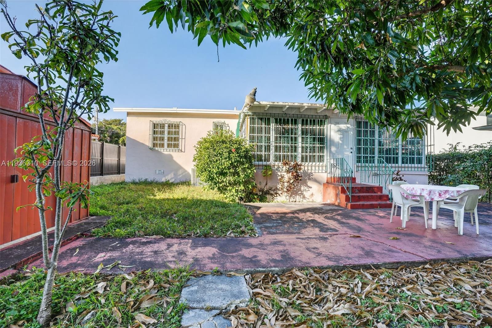 1633 Southwest 30th Avenue Miami, FL 33145 - Photo 24 of 30 a view of a chair and table in backyard of the house