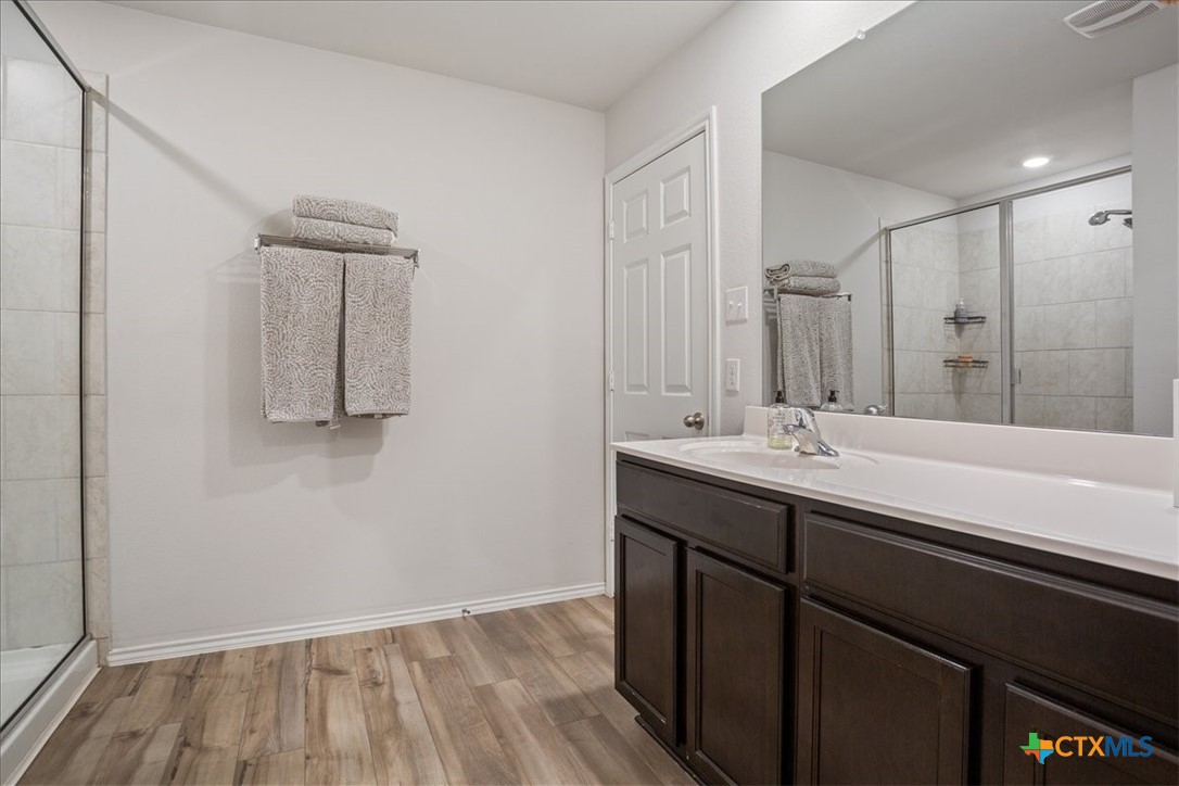 1000 Velvet Court Troy, TX 76579 - Photo 15 of 25 a bathroom with a sink and mirror