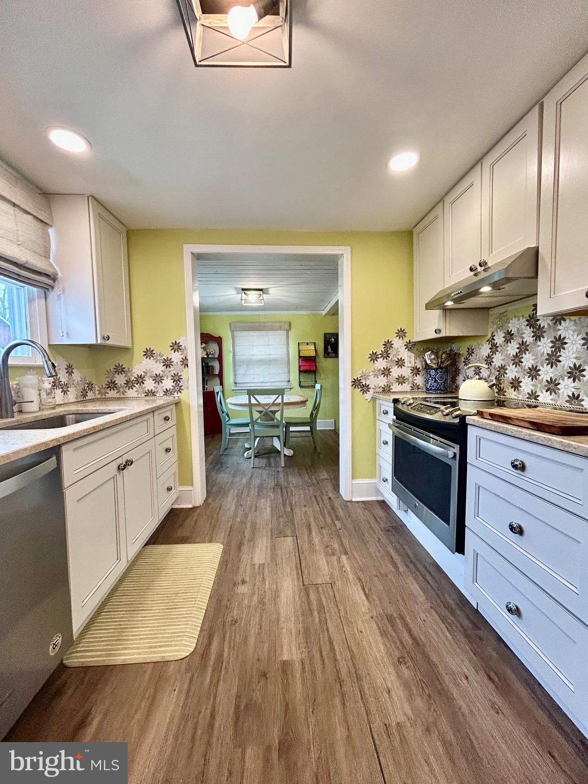 2415 Second Street Pike Newtown, PA 18940 - Photo 17 of 51 a kitchen with stainless steel appliances kitchen island granite countertop a stove a sink and a refrigerator