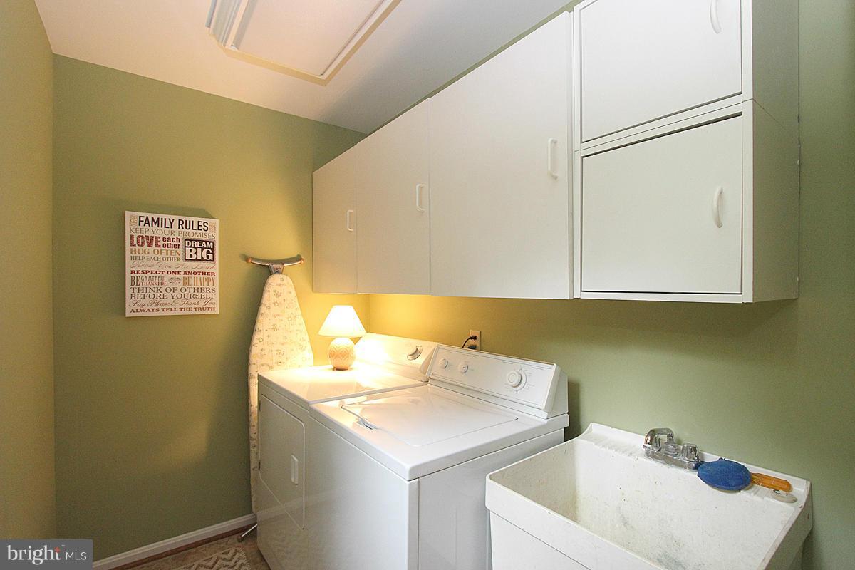 8212 Honeysuckle Road Manassas, VA 20112 - Photo 14 of 30 Laundry Room with Storage off Kitchen and Garage