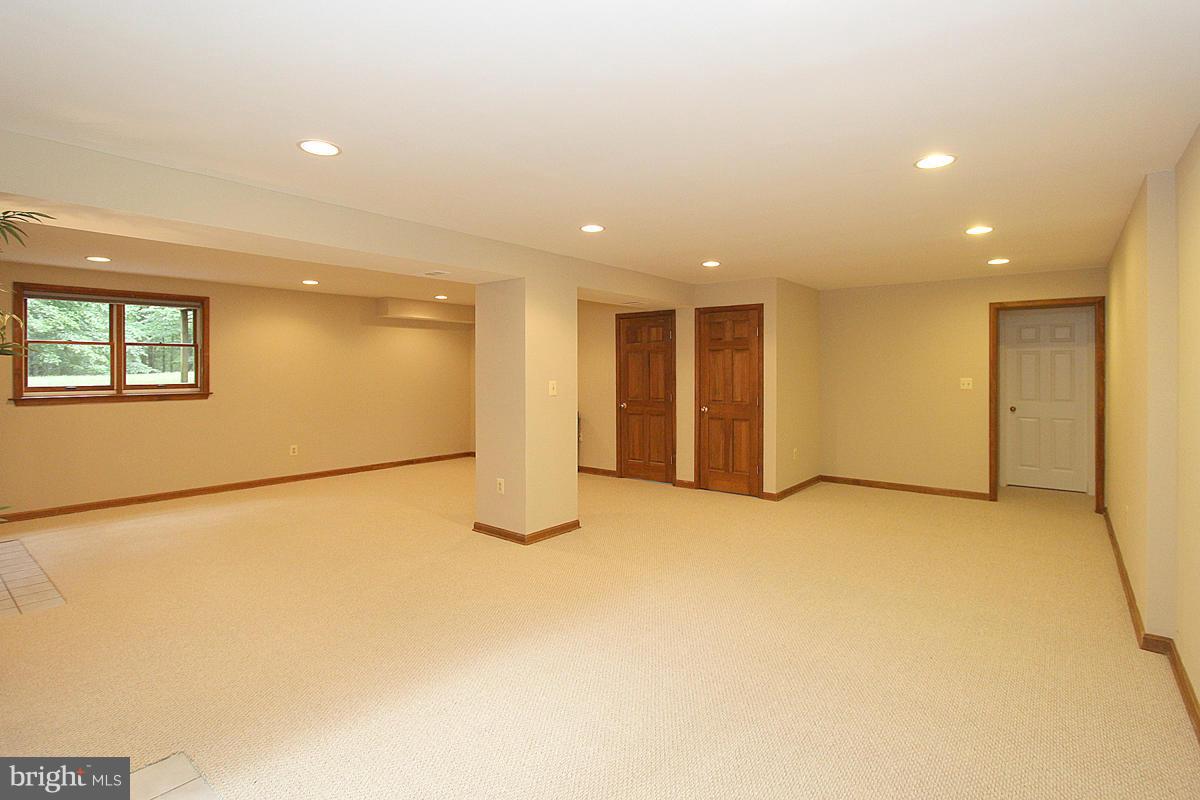 8212 Honeysuckle Road Manassas, VA 20112 - Photo 26 of 30 New Berber Carpet and Unfinished Storage Area