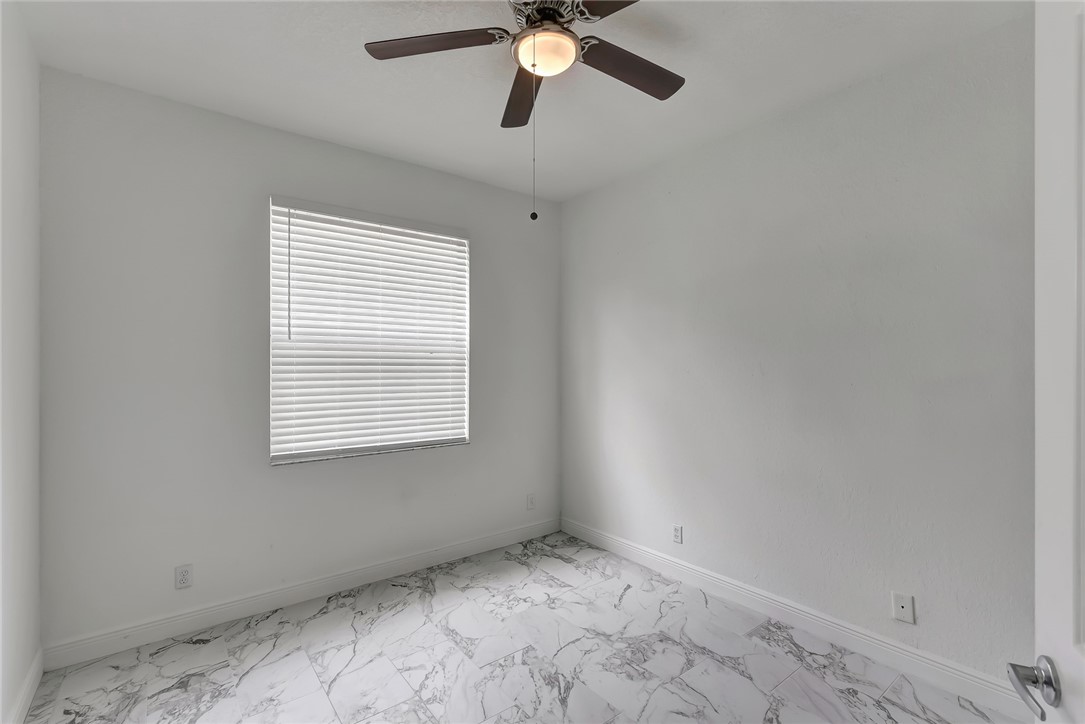 5513 Spanish River Road Fort Pierce, FL 34951 - Photo 13 of 33 a view of an empty room with a window