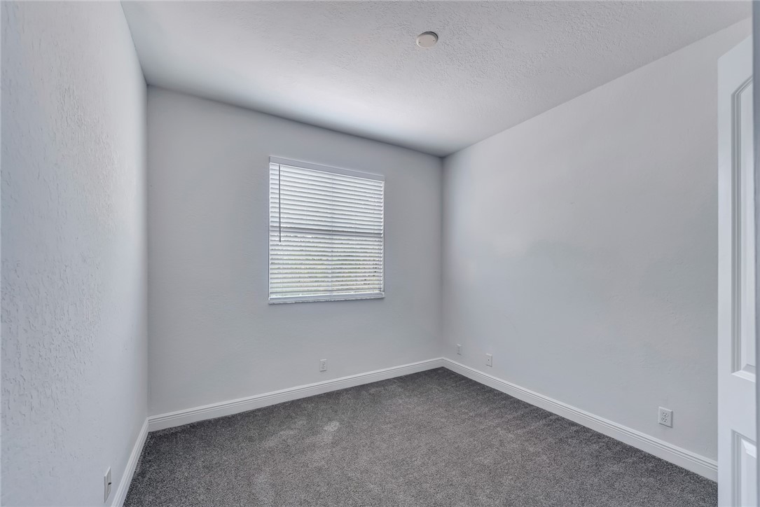 5513 Spanish River Road Fort Pierce, FL 34951 - Photo 20 of 33 an empty room with a window