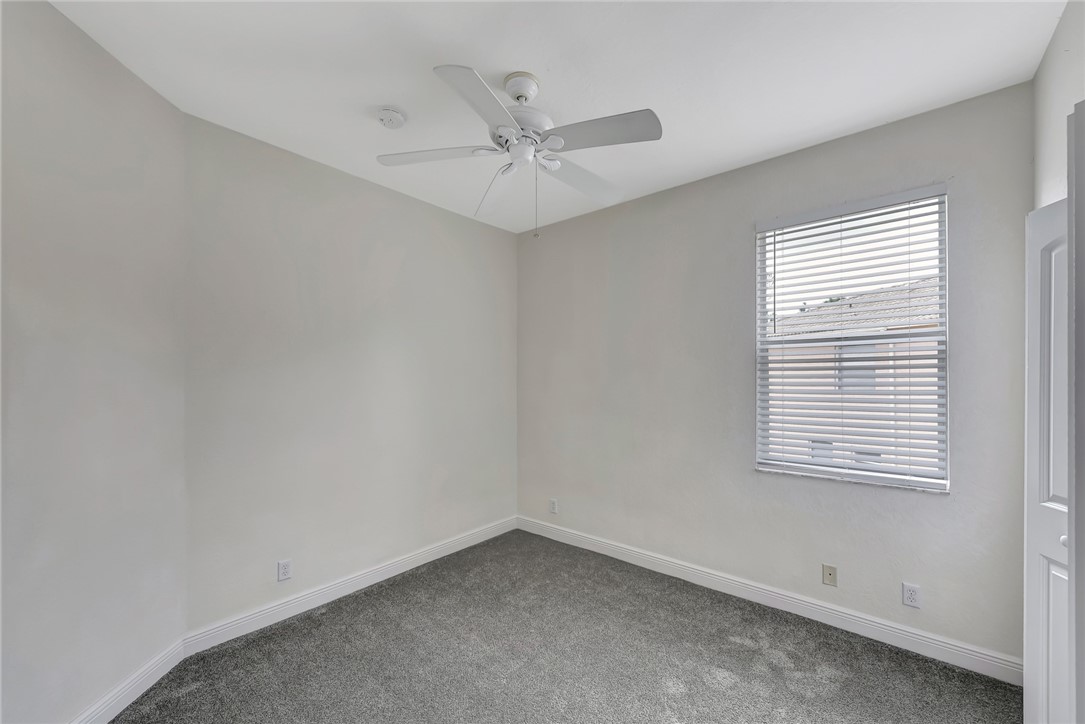 5513 Spanish River Road Fort Pierce, FL 34951 - Photo 23 of 33 an empty room with a window and a fan