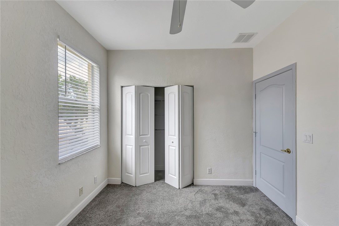 5513 Spanish River Road Fort Pierce, FL 34951 - Photo 24 of 33 a view of an empty room with closet and a window