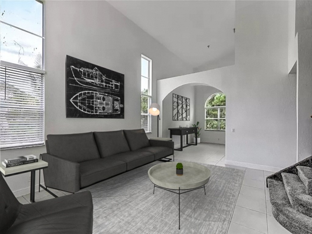 5513 Spanish River Road Fort Pierce, FL 34951 - Photo 29 of 33 a living room with furniture and a painting