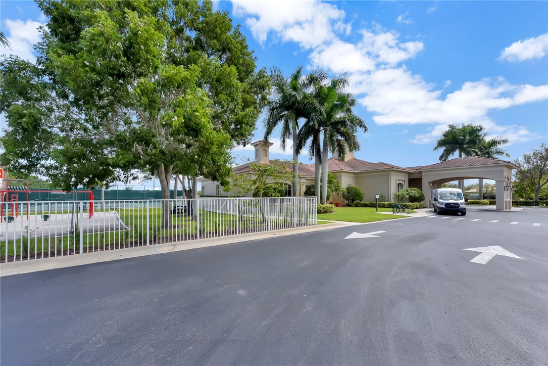 5513 Spanish River Road Fort Pierce, FL 34951 - Photo 33 of 33 a view of a street and a car park in front of house
