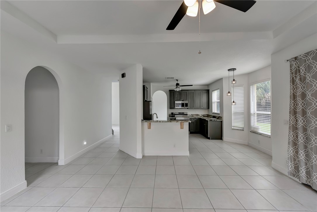 5513 Spanish River Road Fort Pierce, FL 34951 - Photo 10 of 33 a large kitchen with a large counter top appliances and cabinets