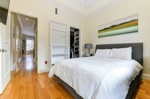 a bedroom with a bed and a walk in closet