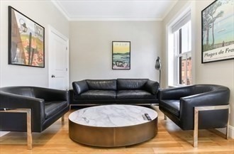 142 West Concord Street, Unit 2 Boston, MA 02118 - Photo 8 of 18 a living room with furniture and a window