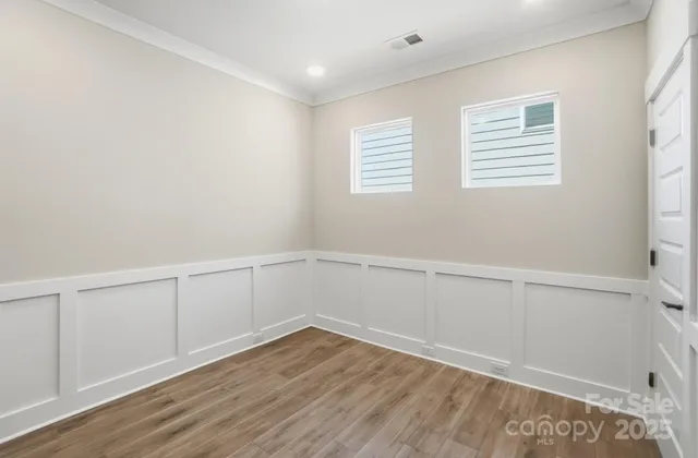 a large kitchen with stainless steel appliances a large counter top a stove a chimney a sink and a refrigerator