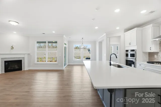 a kitchen with a sink and a refrigerator