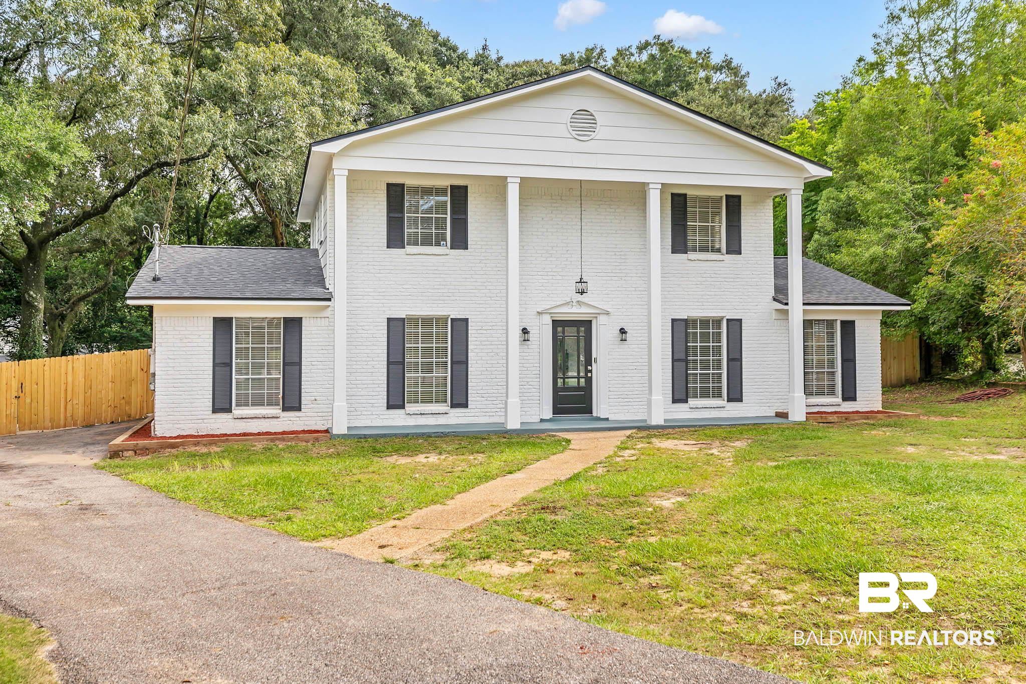 4705 Sherry Court Mobile, AL 36693 - Photo 3 of 100 Greek revival house featuring covered porch, brick siding, and a shingled roof