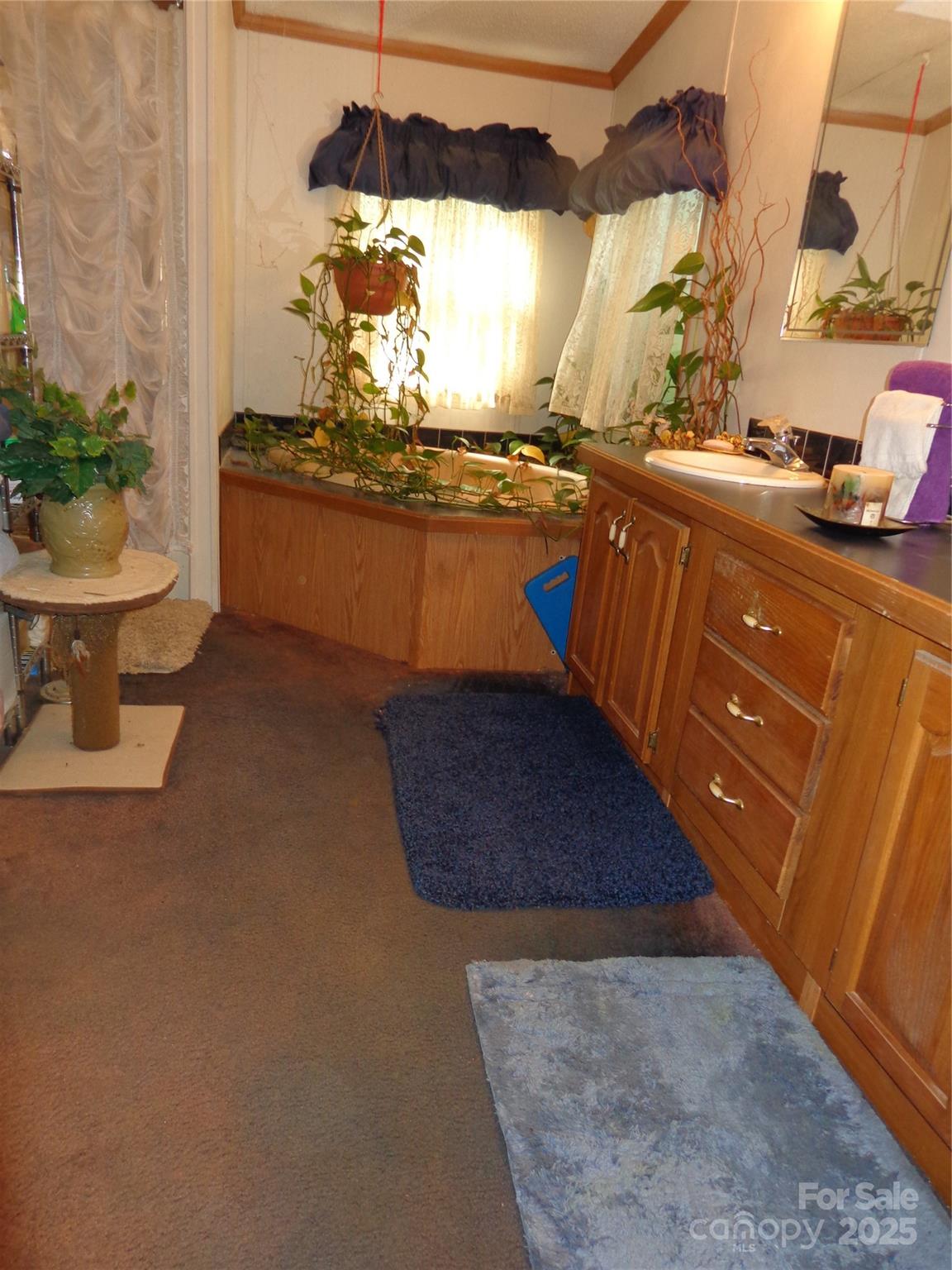 89 Blue Mountain Road Fairview, NC 28730 - Photo 13 of 40 a kitchen with a sink and a stove