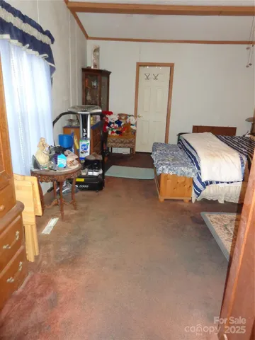 a bedroom with furniture and a window