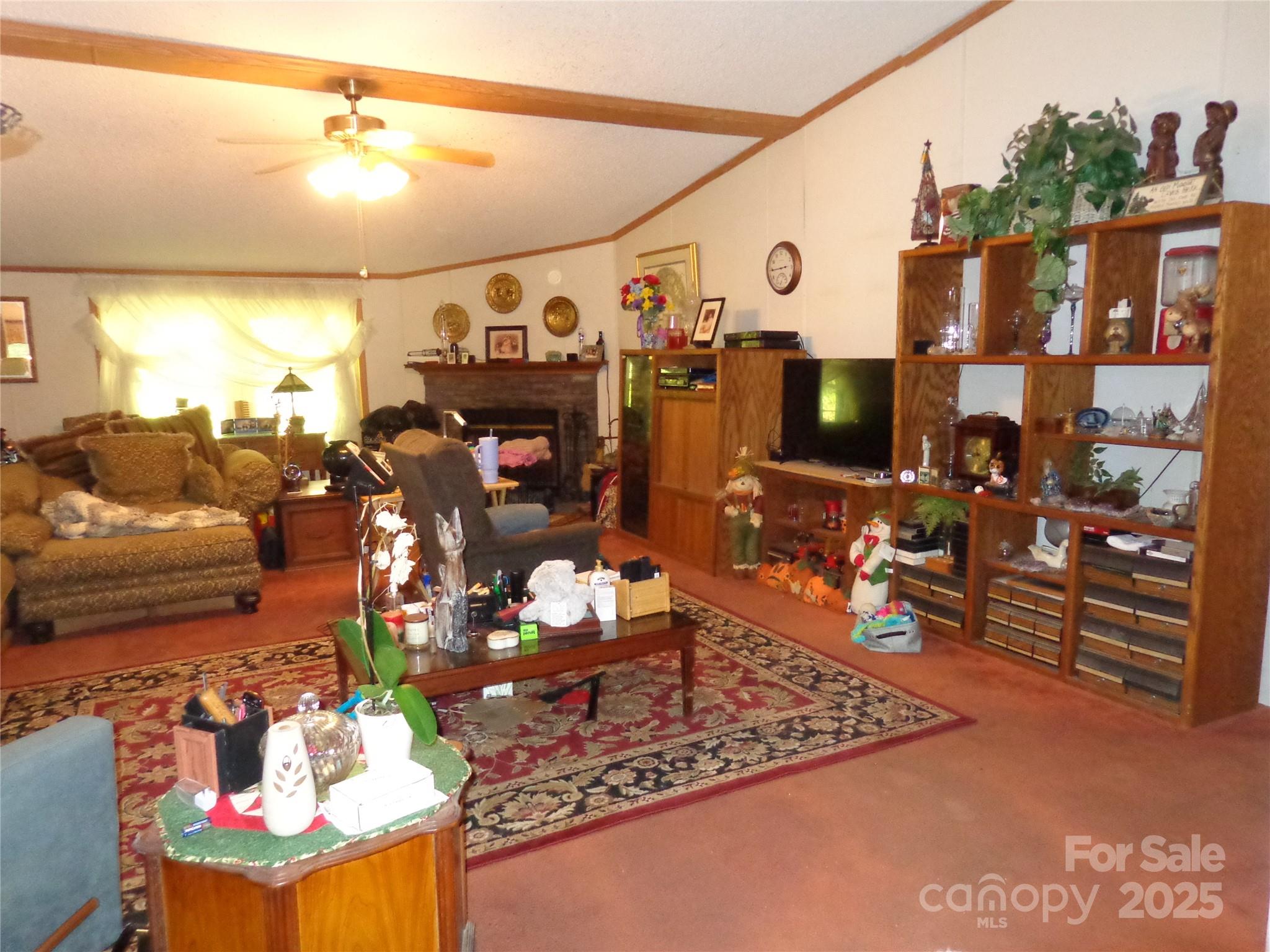 89 Blue Mountain Road Fairview, NC 28730 - Photo 24 of 40 a view of a living room with furniture and a flat screen tv