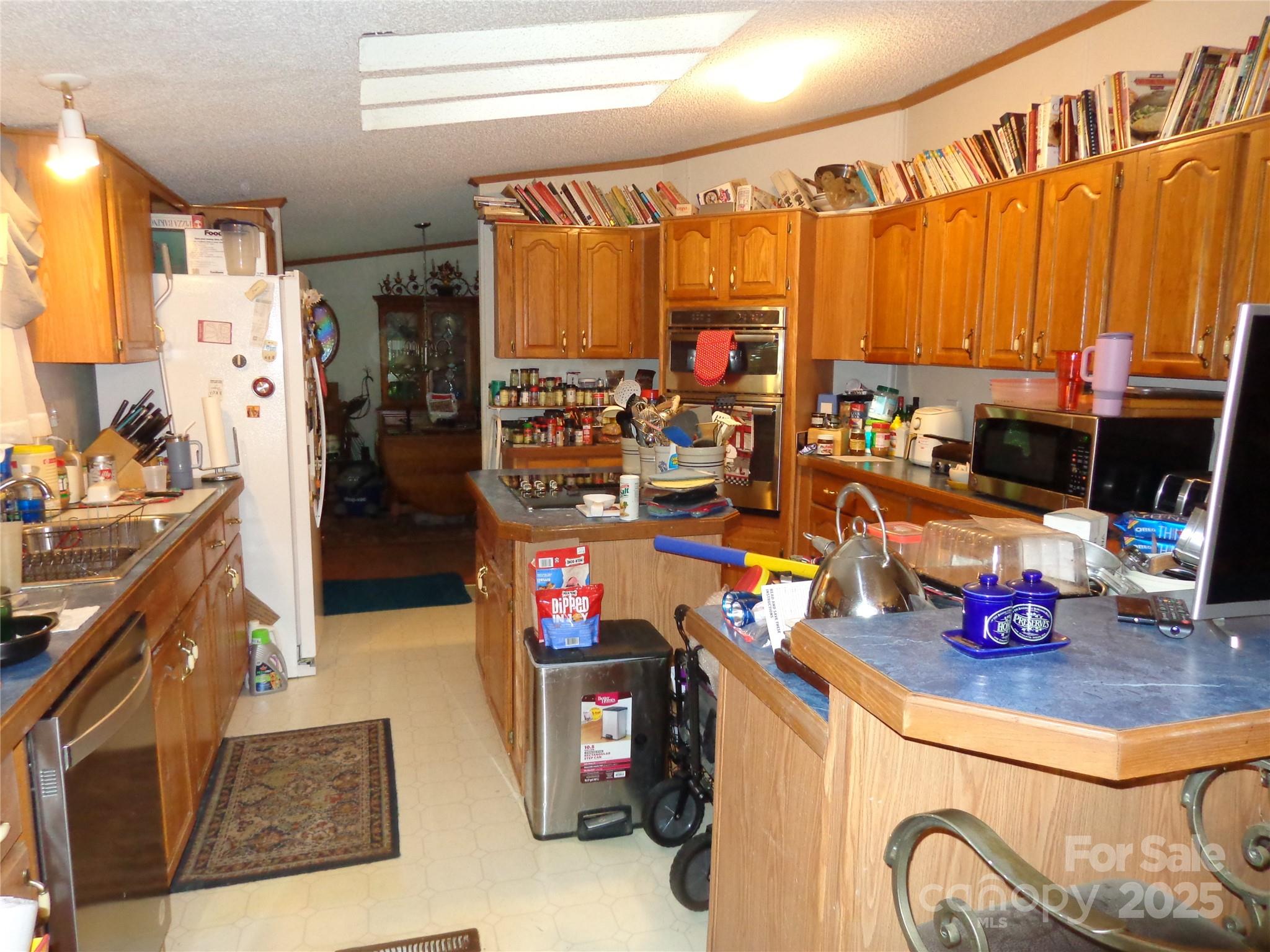 89 Blue Mountain Road Fairview, NC 28730 - Photo 33 of 40 a view of a kitchen with refrigerator and a stove