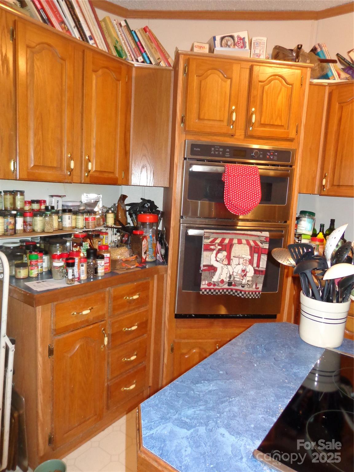 89 Blue Mountain Road Fairview, NC 28730 - Photo 35 of 40 a view of living room with stainless steel appliances kitchen island granite countertop a refrigerator and a stove
