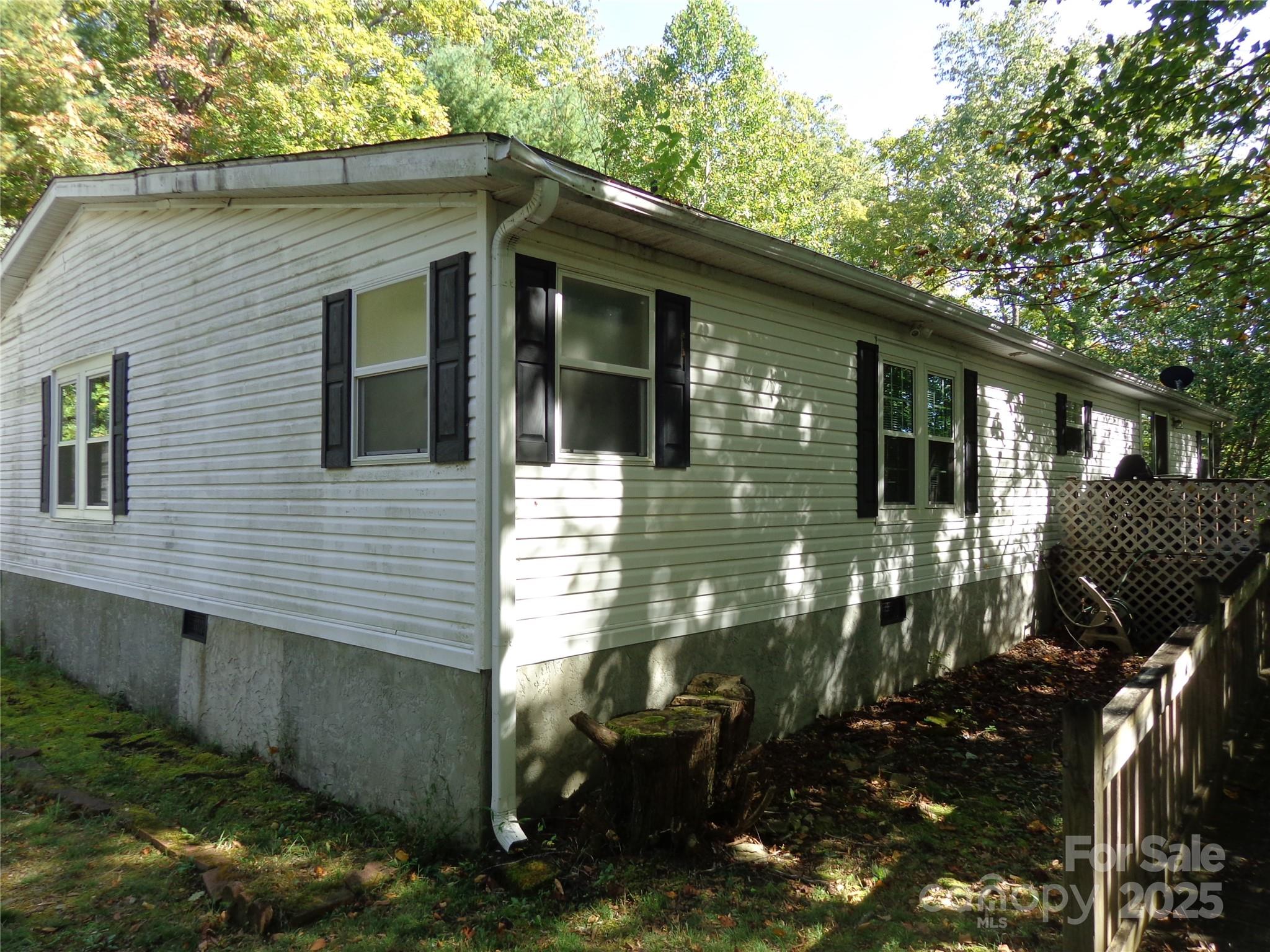 89 Blue Mountain Road Fairview, NC 28730 - Photo 5 of 40 a view of a house with backyard