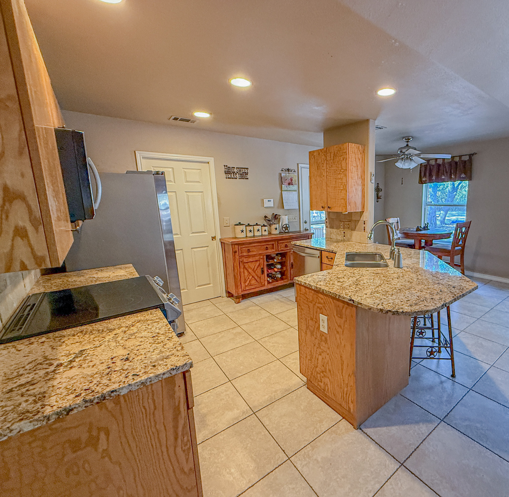 Undisclosed Address Georgetown, TX 78633 - Photo 17 of 37 a kitchen with stainless steel appliances granite countertop a sink and a refrigerator